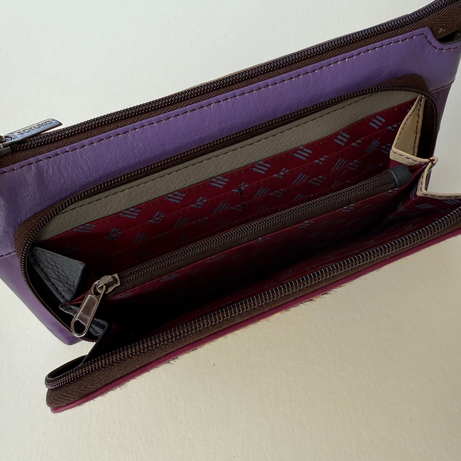 interior view of turquoise madison crossbody front pocket