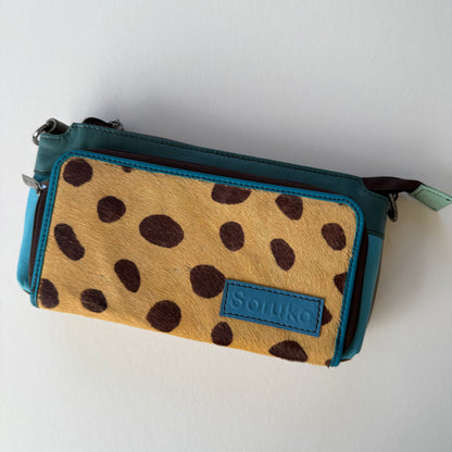 turquoise madison crossbody with blue body and brown on brown animal front pocket
