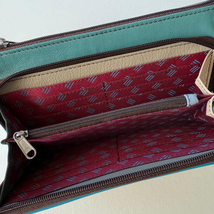 interior view of turquoise madison crossbody front pocket