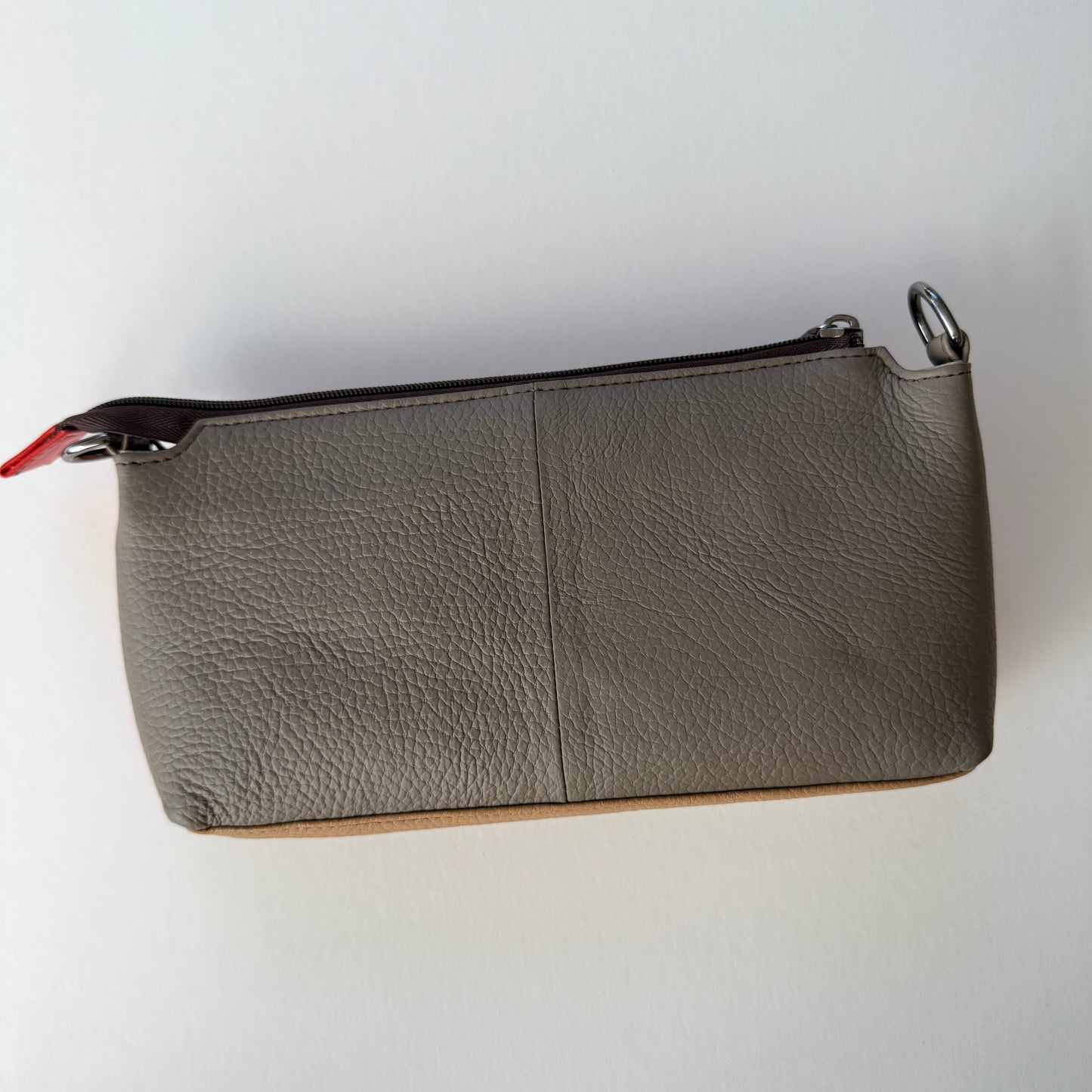 back view of sunrise madison crossbody with taupe back