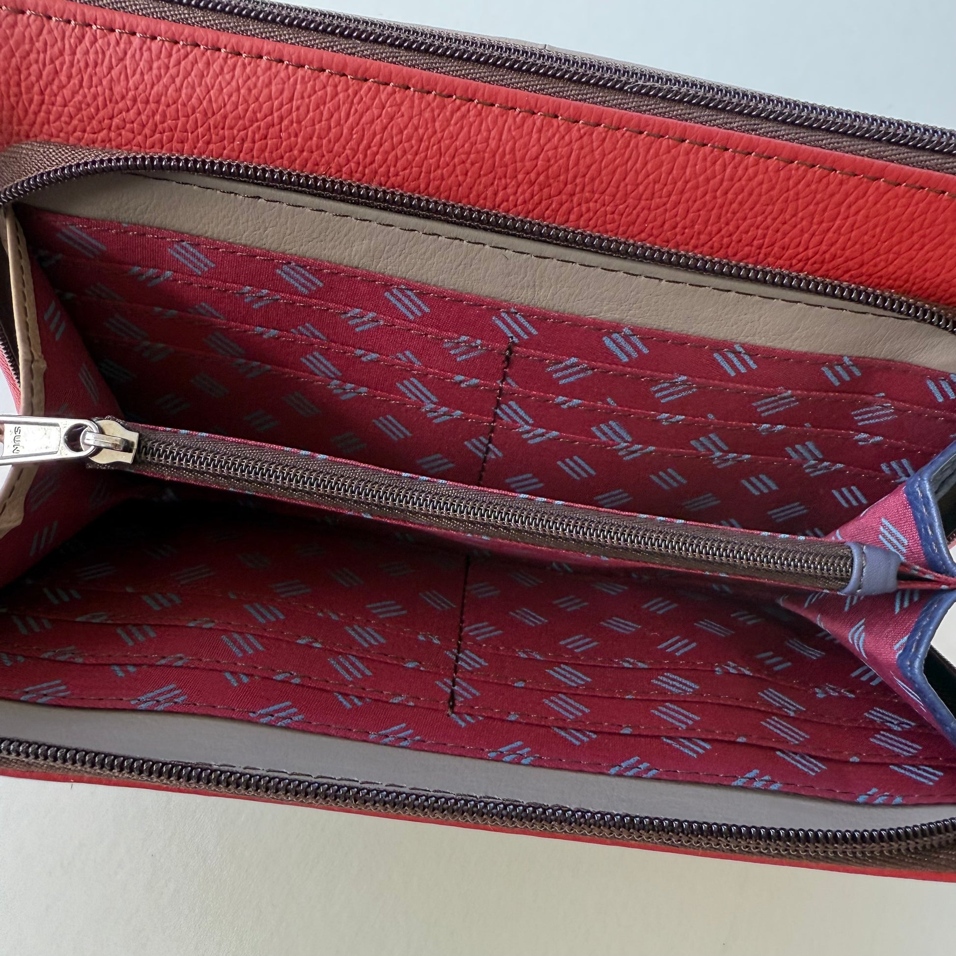 interior view of cranberry madison crossbody front pocket