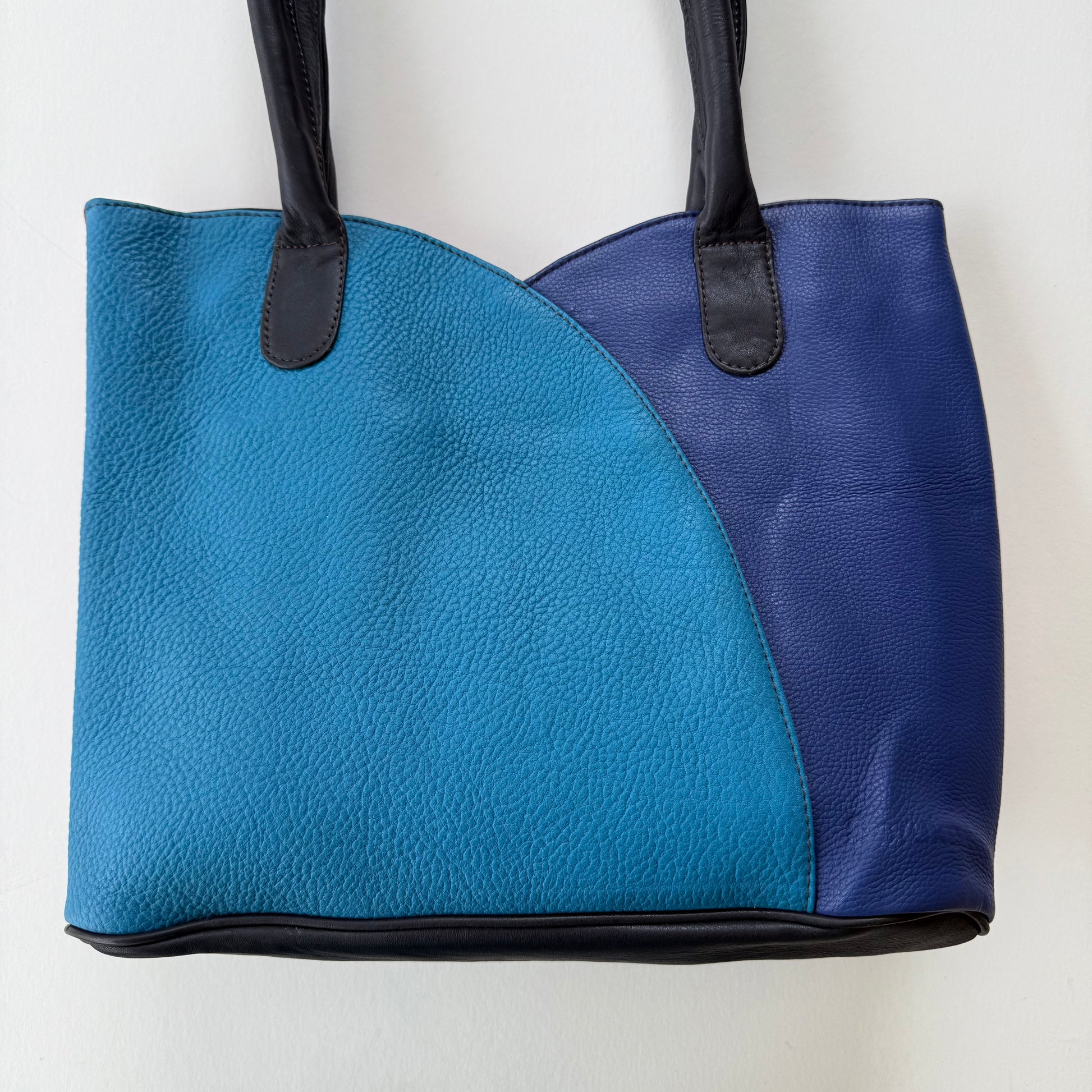 2 tone Blue and black tote bag on a white background