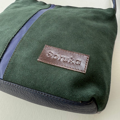 bottom cornet of green and purple handbag