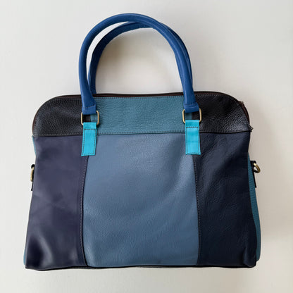back view of Two-tone blue handbag with a white background