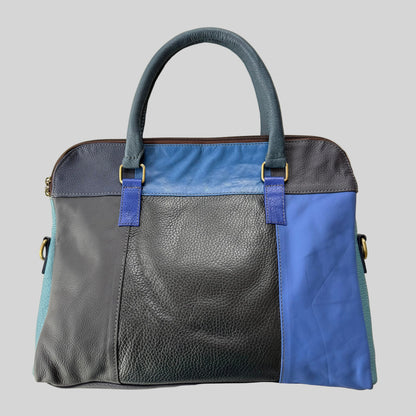 Handbag with blue and gray design on a beige background