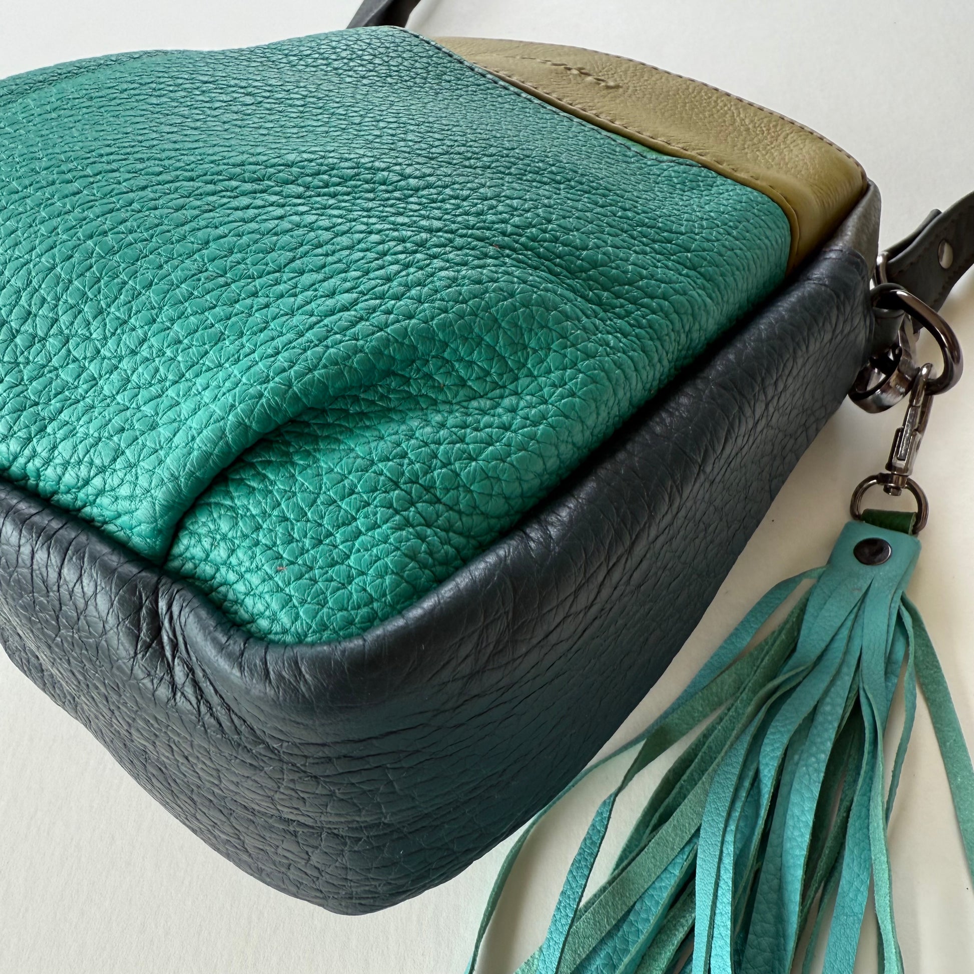 bottom view of handbag with tassel