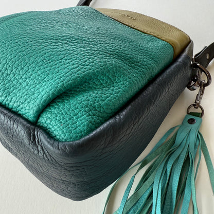 bottom view of handbag with tassel