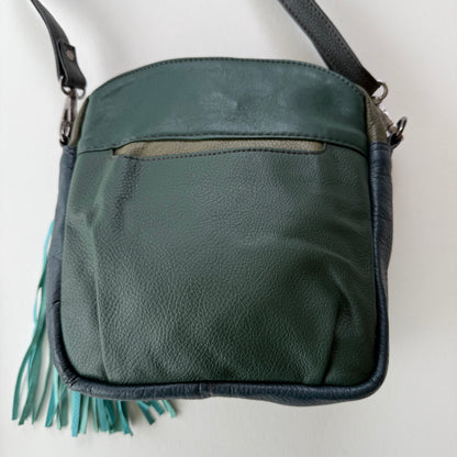 back view of handbag with dark green backing