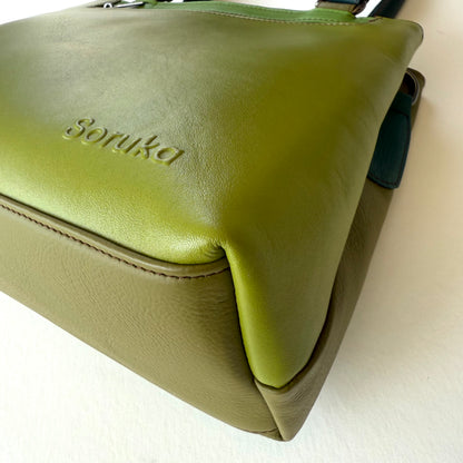 bottom view of green leather handbag