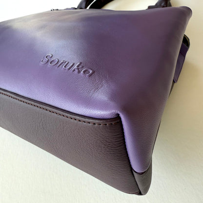 bottom view of purple handbag