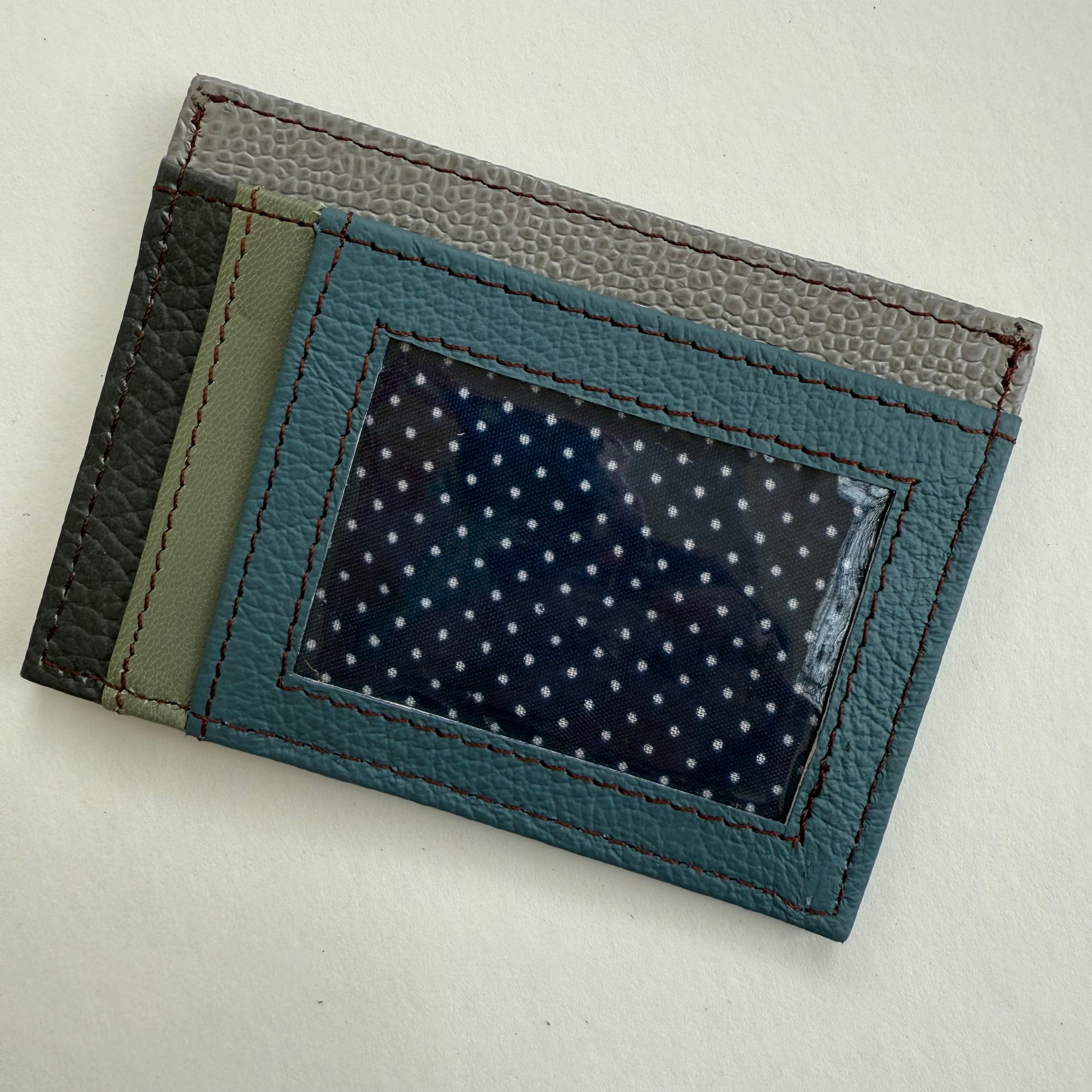 grey green and blue wallet with clear ID pocket