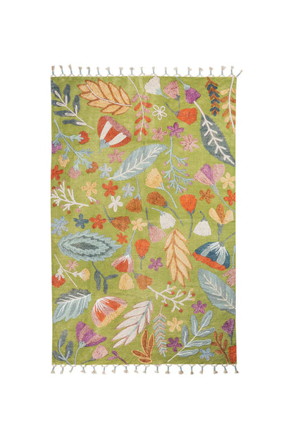 Floral patterned rug with tassels on a white background