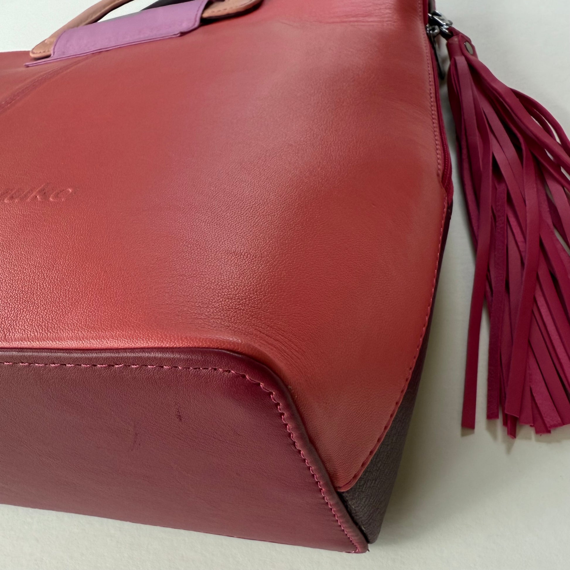 bottom corner of pink tote bag