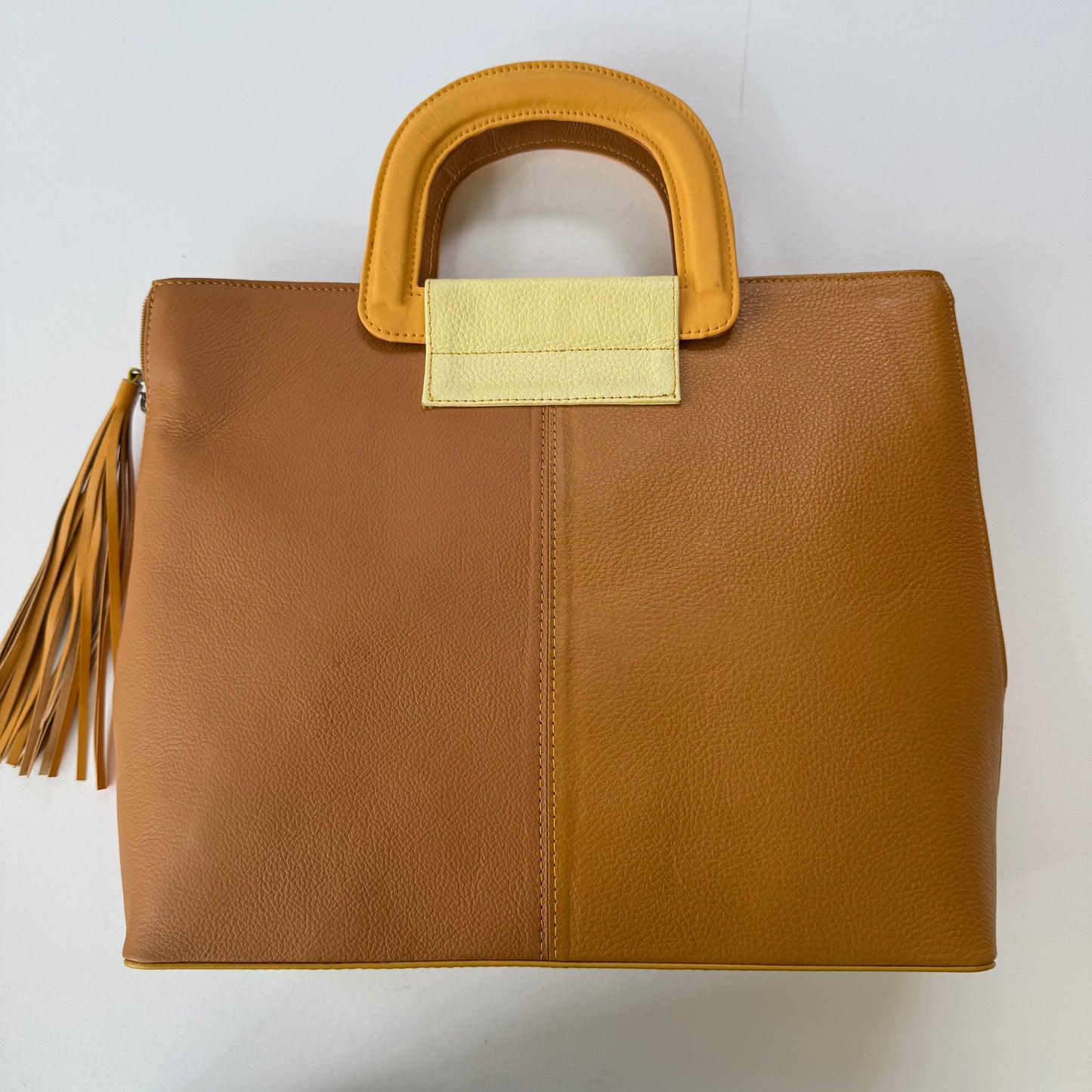 other side of yellow-brown tote bag with tassel