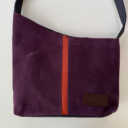 Purple bag with a red stripe down the middle