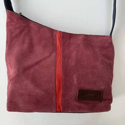 Maroon handbag with a red stripe down the middle