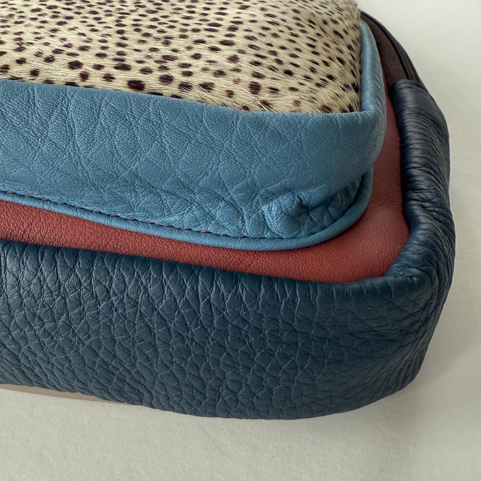 side view of multi-colored sling bag