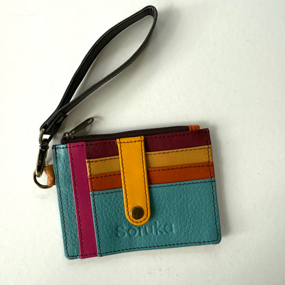 small wallet with colorful card slots, a yellow tab, and dark wristlet strap
