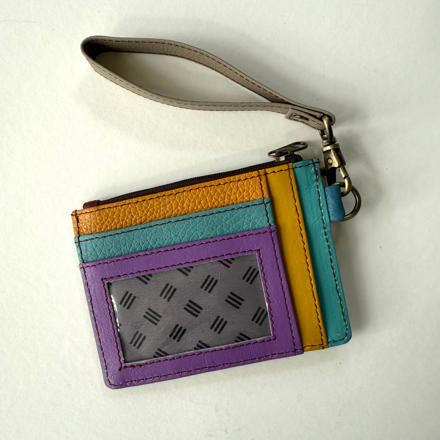 other side of wallet with colorful card slots and clear ID pocket