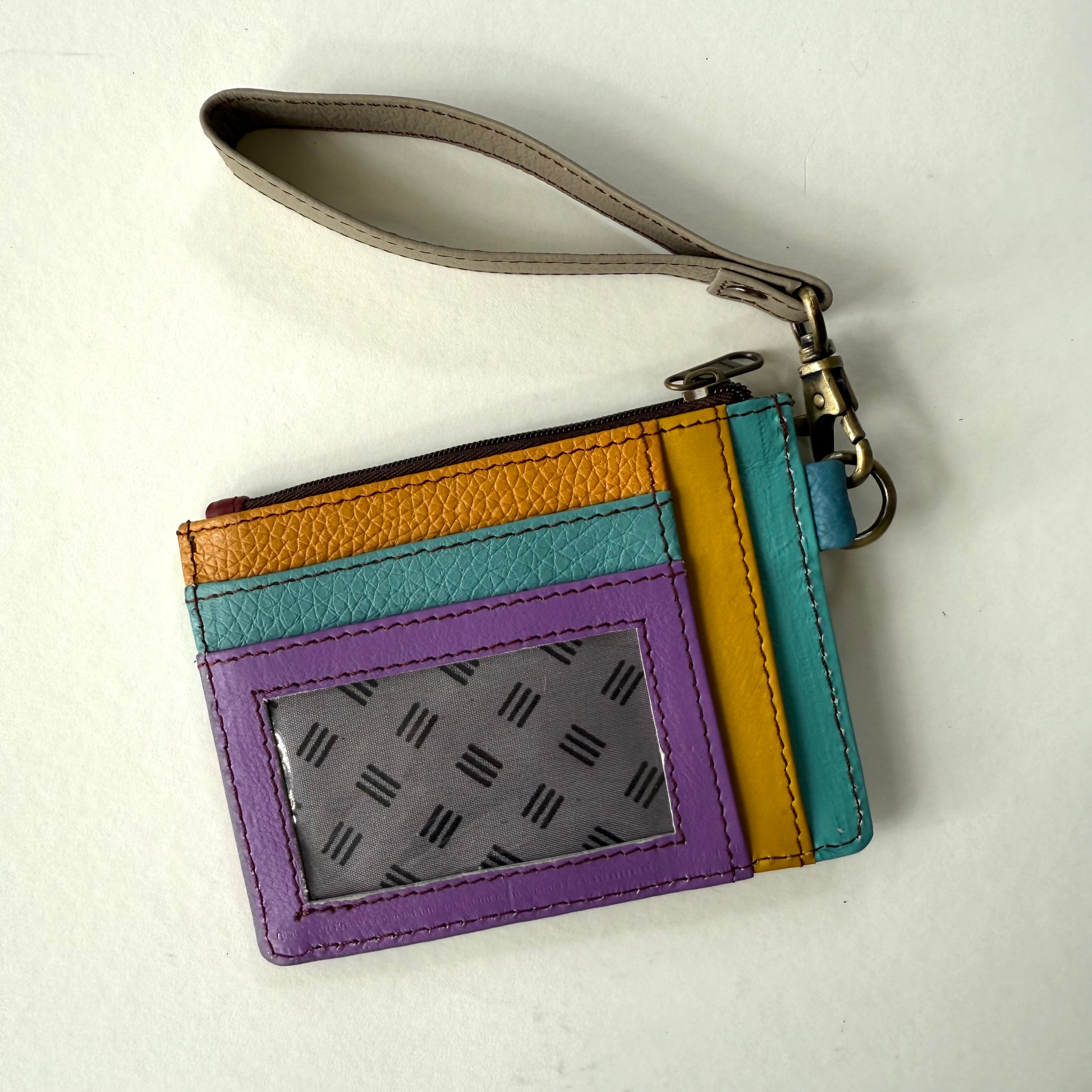 other side of wallet with colorful card slots and clear ID pocket