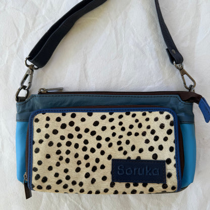 small blue crossbody with dark navy strap