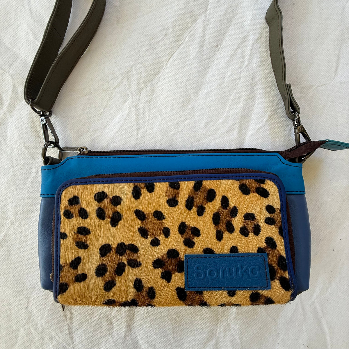 small blue and leopard print crossbody with dark taupe strap