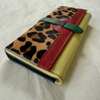 side view of wallet with leopard flap and yellow body