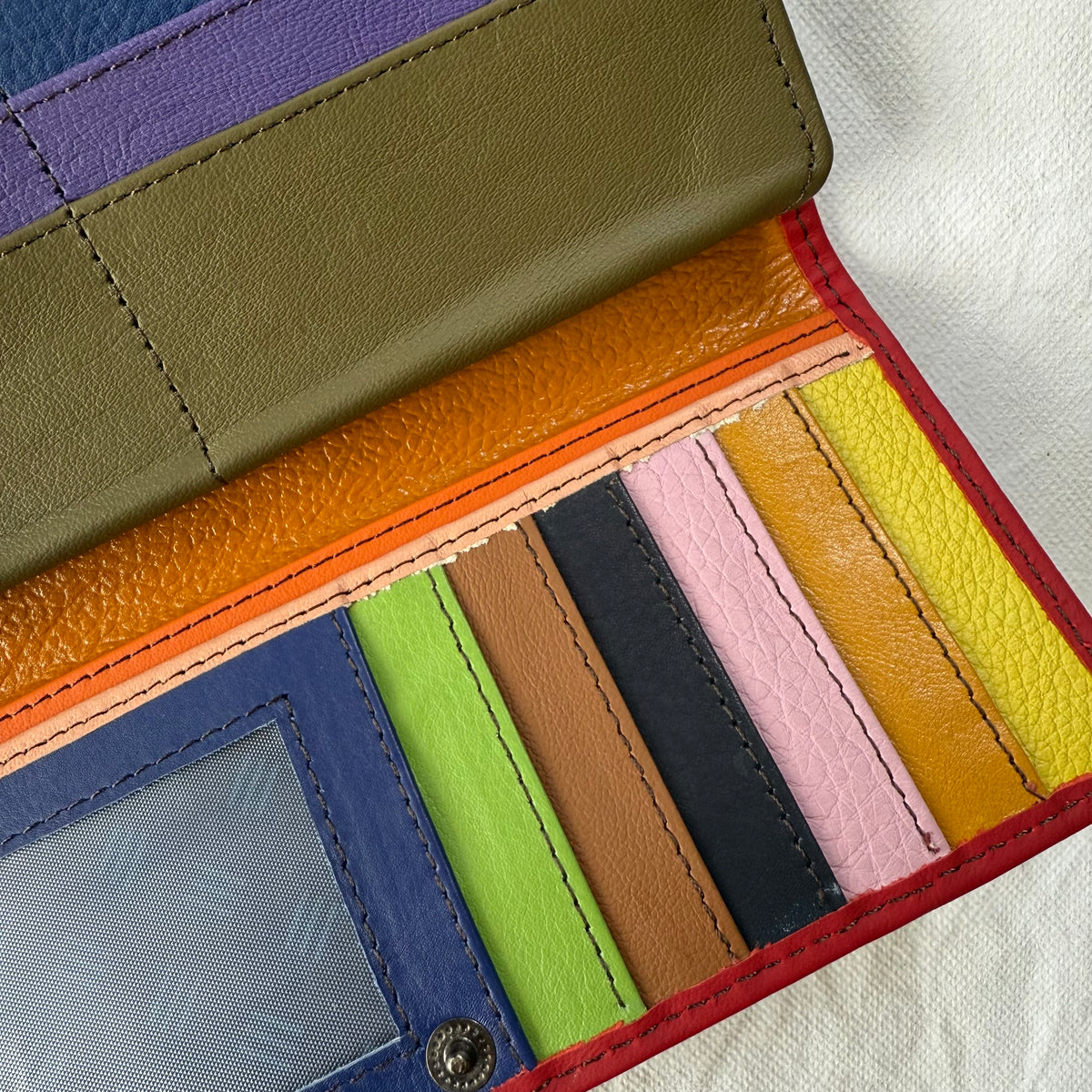 close-up of colorful card slots and clear I D pockets