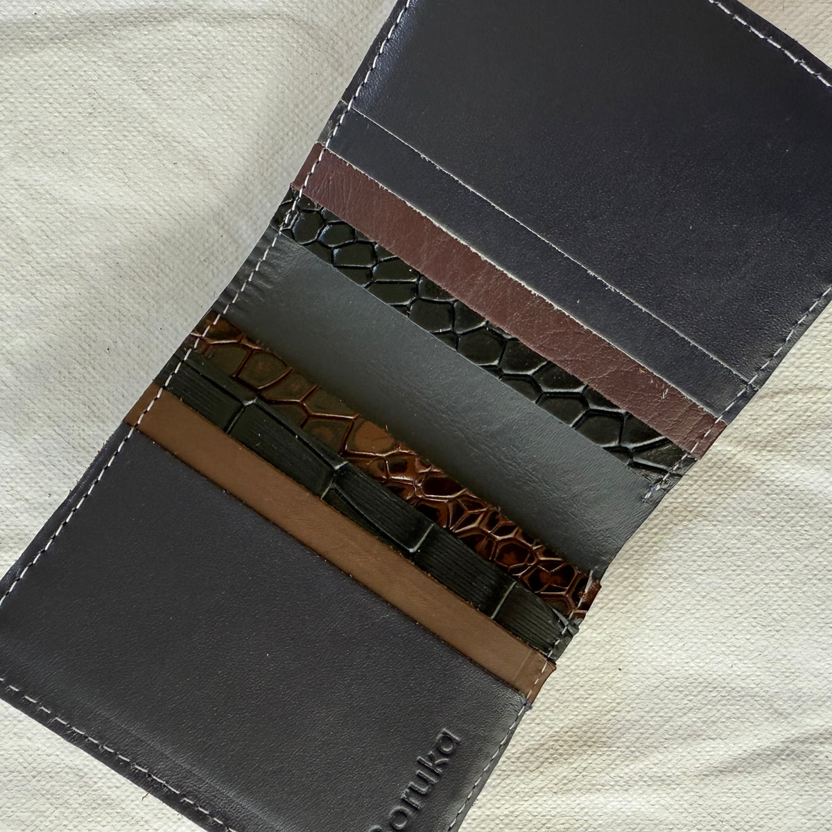 interior view of wallet with brown and black card slots
