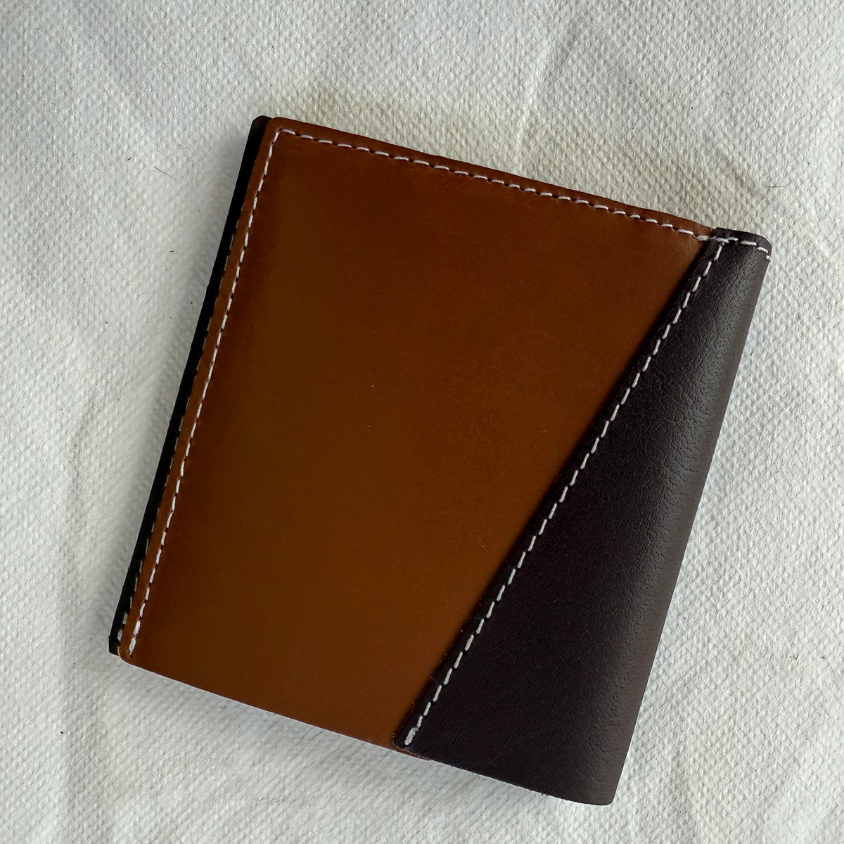 wallet in light and dark brown leathers