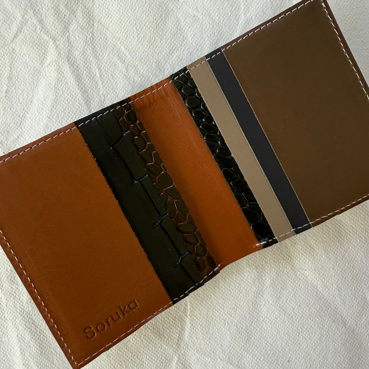 interior view of wallet with cards slots in brown leathers
