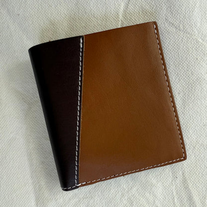 other side of wallet with light and brown leathers and white stitching