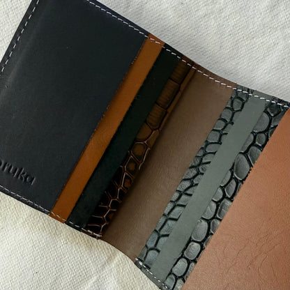 interior view of wallet showing card slots in black and browns