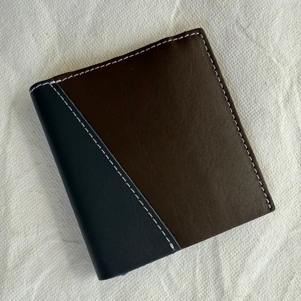 other side of wallet with dark brown and grey leathers