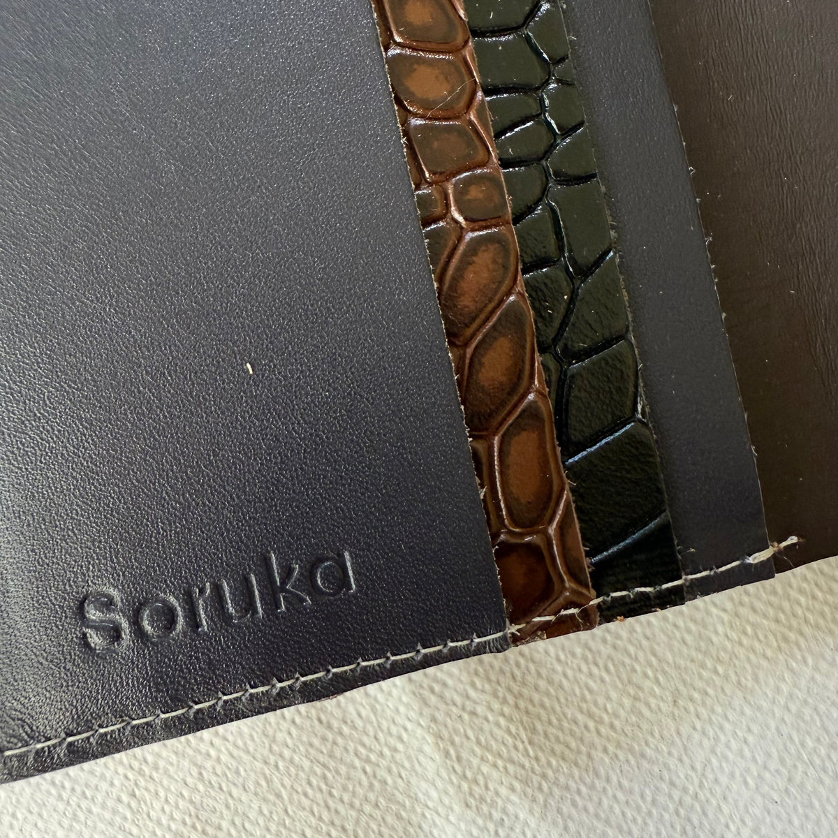 close-up of card slots in black and brown