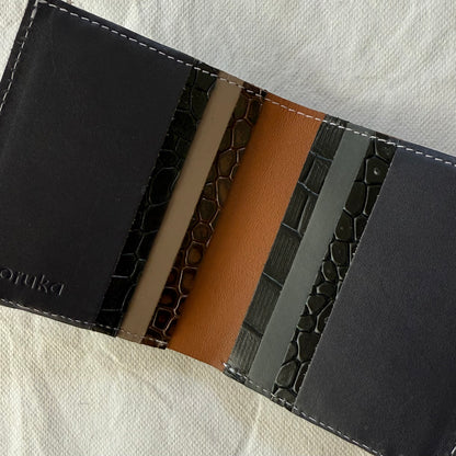 interior view of wall with card slots in an array of browns and black