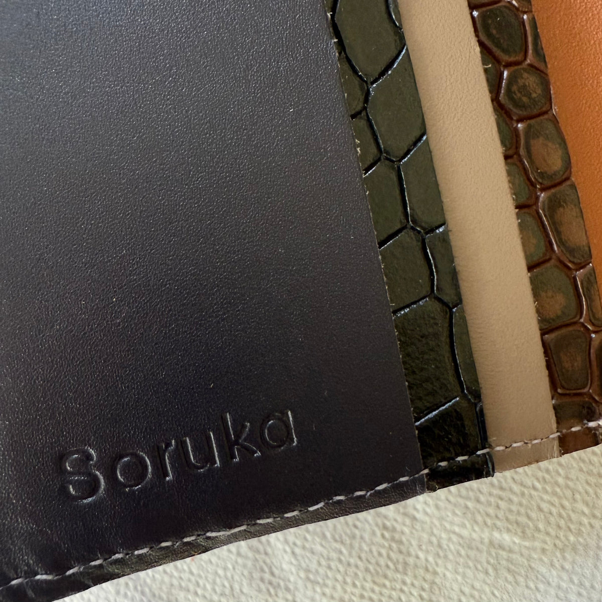 close-up of card slots in black and browns