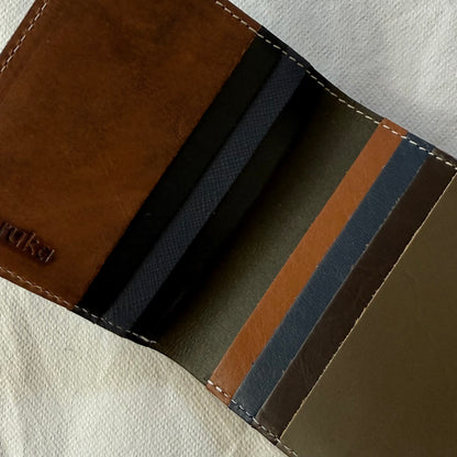 interior view of wallet with card slots in browns and blues