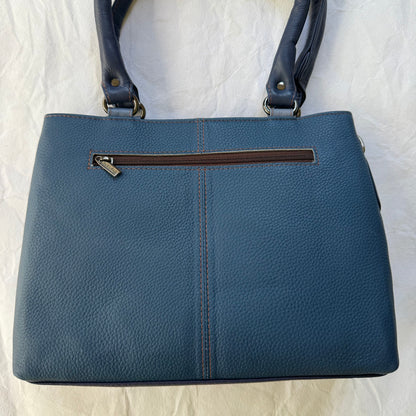 other side of blue handbag in deep blue leather with a zipper pocket across the top