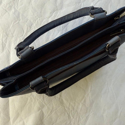 top view of blue handbag with 2 zipped compartments