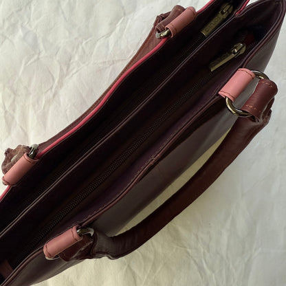 top view of pink handbag with 2 zipped compartments