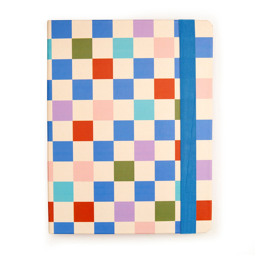 closed view of notepad showing colorful checkered design in cream, red, green, and shade of blue