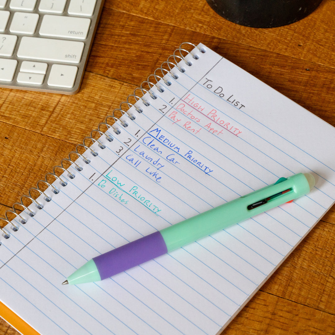 green pen on a note pad