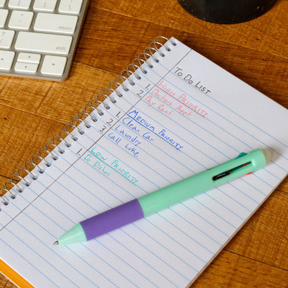 green pen on a note pad