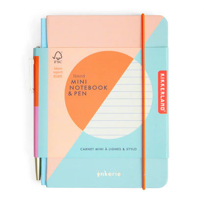 small notebook with peach and blue cover and pink and orange pen on its spine