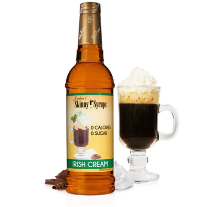 bottle of irish cream skinny syrup set next to a coffee beverage.