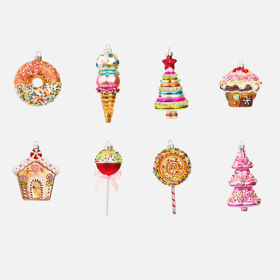 colorful glass ornaments shaped like various sweets including a donut, ice cream, cupcakes, a lollipop, and a candy cane.