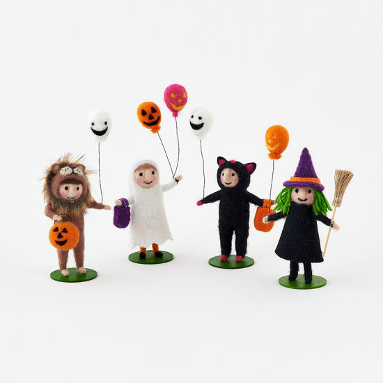 felt figures designed for Halloween, including a lion, a ghost, a black cat, and a witch, each holding a balloon.