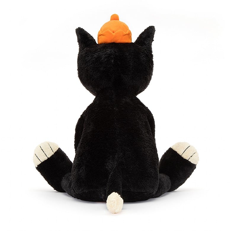 back view of jellycat jack, a black and white stuffed animal wearing an orange crown.