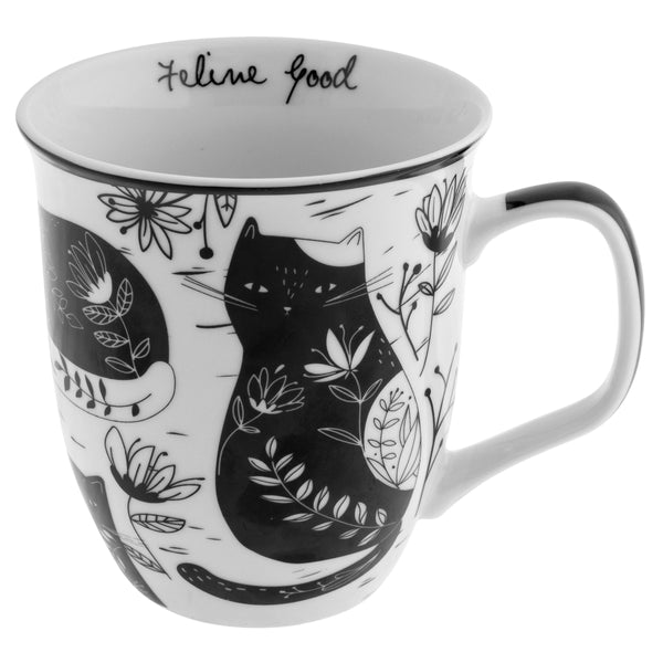 white mug with cat and floral pattern in black and "feline good" in the inner rim.